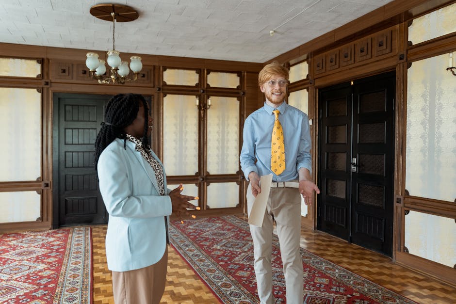 Business professionals conversing in a stylish, traditional office space.